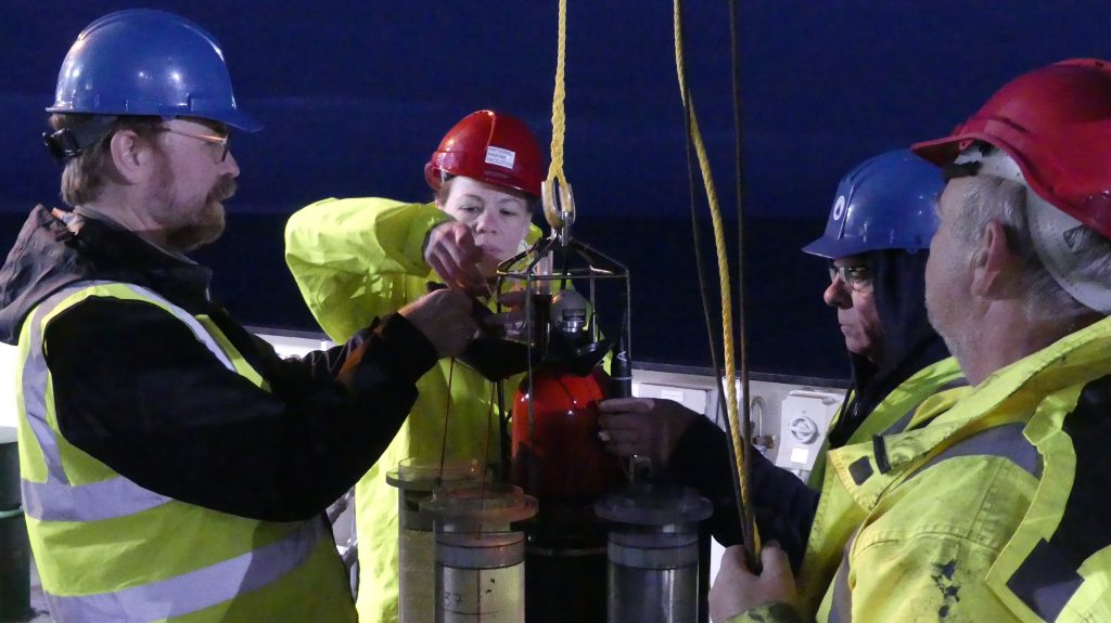 Ken Buesseler, Meg Estapa &amp; Steve Pike (left to right) preparing an NBST to deploy.